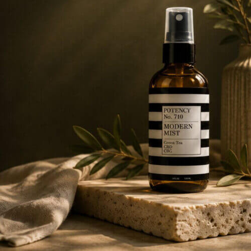 Modern Mist spray bottle on travertine