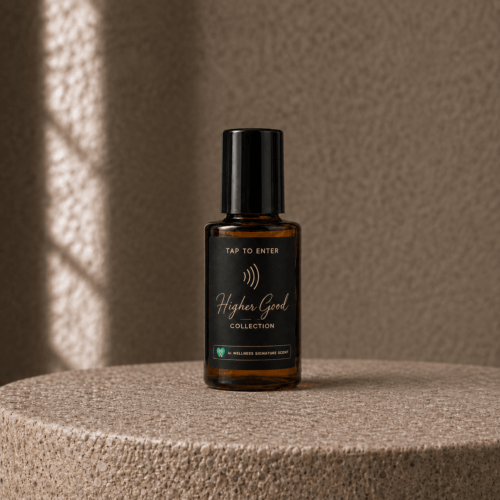 Higher Good amber dropper bottle on a stone pedestal in sunlight