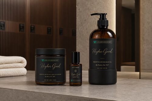 Higher Good Collection jars and pump bottles on a spa counter
